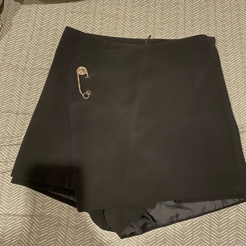 Black skort with pin detail